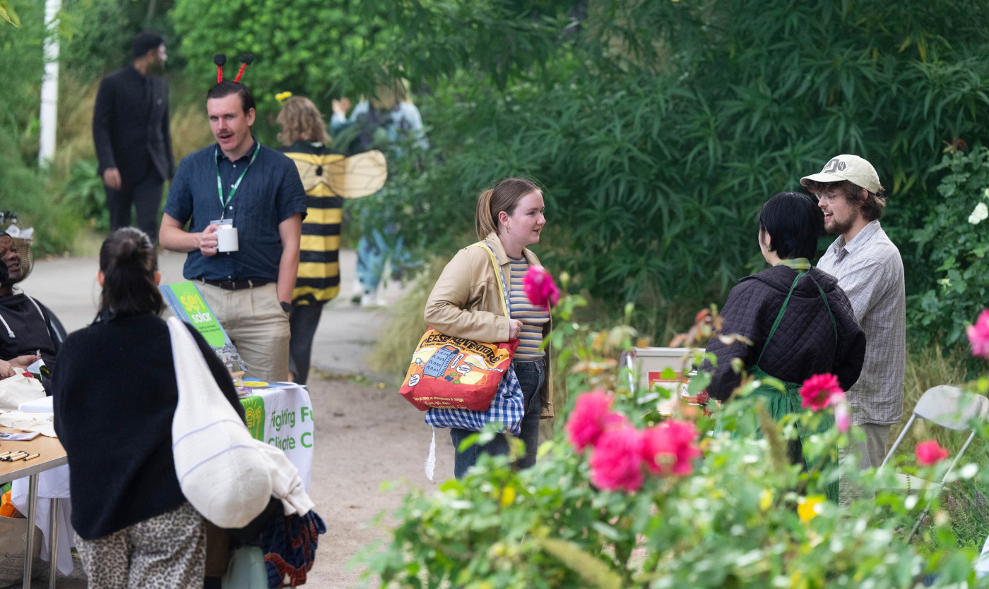 People standing and chatting in St John's garden as part of the Waterloo and South Bank Fun Day.